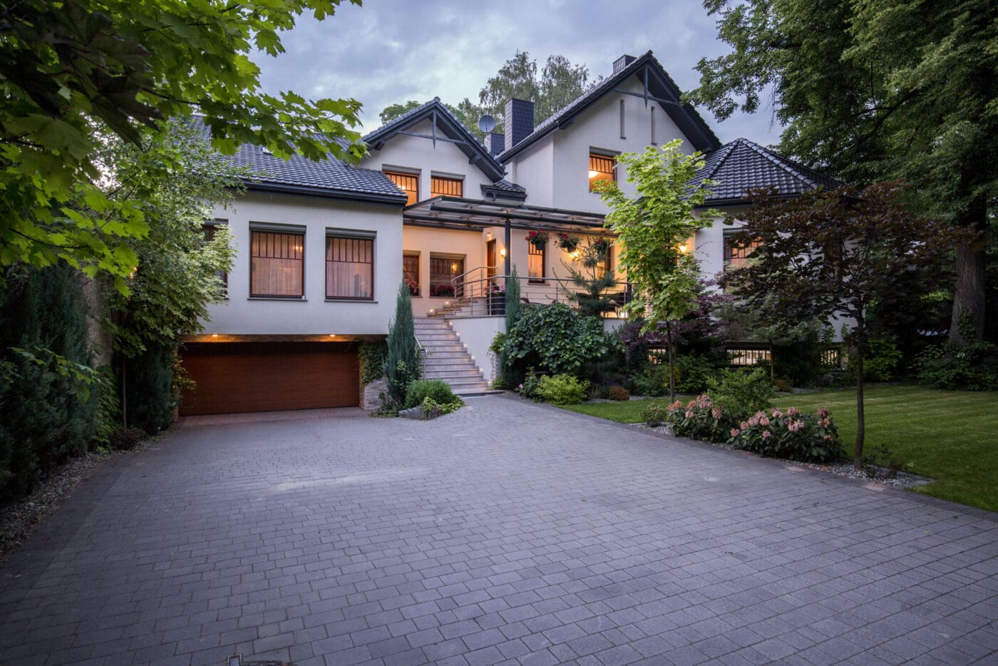 Outside of house with lights on inside